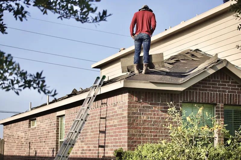 Professional roofer working on a residential roof in Villages at Wesley Chapel